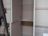 a metal cabinet that is sitting in a garage