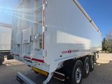 a white semi trailer parked in a lot