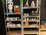 two shelves with various items on them in a room