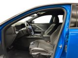 the interior of a blue car with the door open and the driver ' s seat down