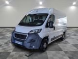 a picture of a white van parked in a large room