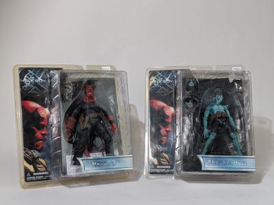 two action figures of the same character are shown in plastic packaging