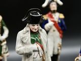 five figurines of men dressed in military uniforms