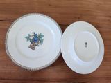 two plates that are sitting on a wooden table