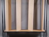 a wooden shelf that has three sections of wood on it