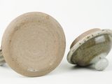 pair of ceramic knobs on white background with white background