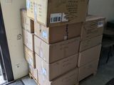 a stack of boxes on a pallet next to a door