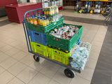 a cart full of drinks and drinks in a store