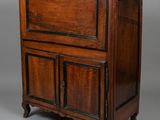 an old wooden cabinet with two doors and two drawers