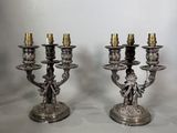 paire de chandeliers anciens en métal argenté, ornés d'anges et de chérubins