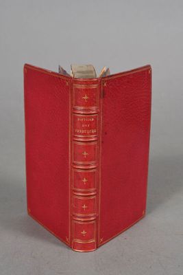 a red book that is open on a table