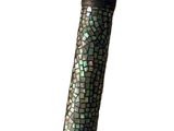 a close up of a black and green umbrella with a white background