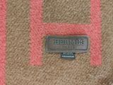 a picture of a close up of a name plate on a rug