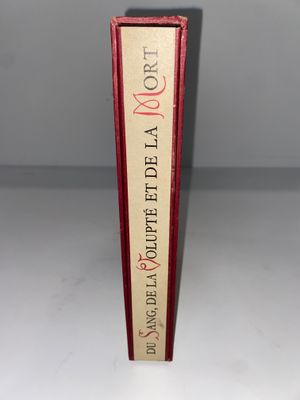 une image représentant un livre rouge et blanc à la couverture rouge