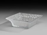 a glass bowl that is sitting on a table
