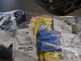 a pile of books wrapped in plastic on a table