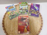 nintendo wii games on a bamboo tray with a basket on the table