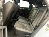 the back seats of a white car with a black seat belt