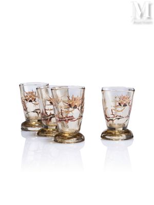 three shot glasses sitting on top of each other in front of a white background