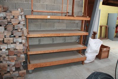 a pile of wood stacked on top of each other in a room