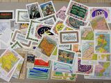 a lot of postcards on the floor of this room