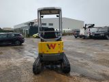 an image of a construction vehicle parked in a parking lot