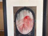 an image of a framed picture of a red and white circle
