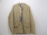 an image of a jacket hanging on a hanger on a wall