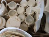 a box full of tea cups and saucers on the table