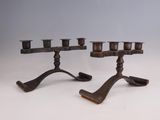 pair of antique cast iron candlesticks on cast iron stands