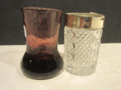 two glass vases sitting next to each other on a table