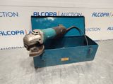 a blue box with an electric tool in it sitting on a table