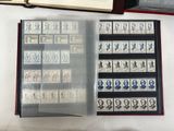 a lot of stamps on a table with a book