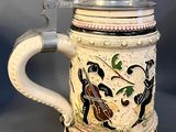 a beer mug that is sitting on top of a table