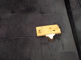 a piece of wood that has been placed on top of a couch