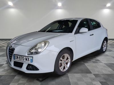 a picture of a white car parked in a garage