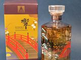 l'image d'un flacon de parfum posé à côté d'une boîte