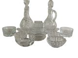 a picture of a group of glass items on a white background