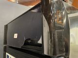 a microwave sitting on top of a refrigerator in a kitchen