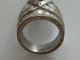 a picture of a wedding ring with a diamond on it