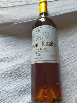 a bottle of wine that is sitting on a towel
