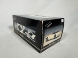 a box with a picture of a white car in it