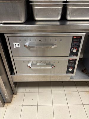several pans of food are stacked on top of each other in a kitchen