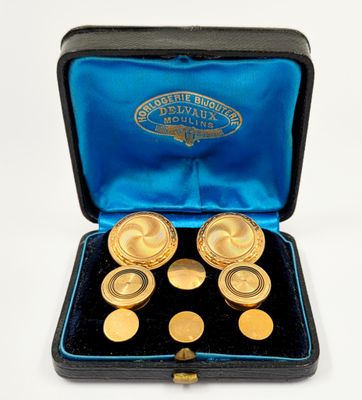 deux paires de boutons de manchette plaqués or dans un étui bleu
