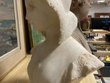 a statue of a woman wearing a veil on a table