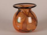 a glass vase with a black rim on a white background