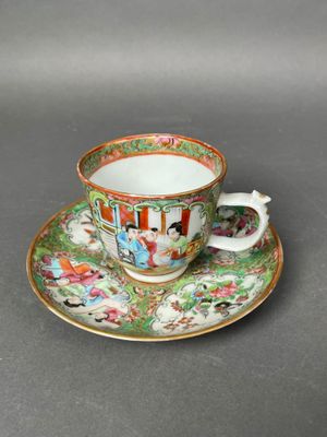 a close up of a cup and saucer on a table