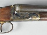 a close up of a gun on a table with a white background