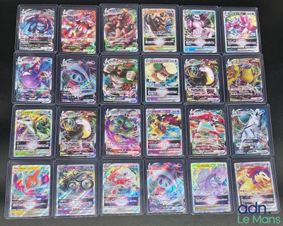 gros plan d'une collection de cartes pokemon sur une table