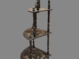 a tall metal shelf with three tiers on top of it